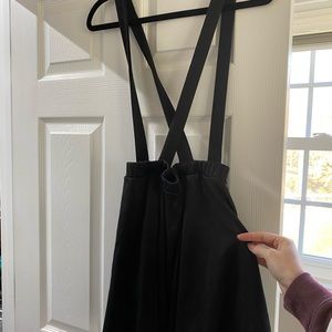 black skirt with suspenders